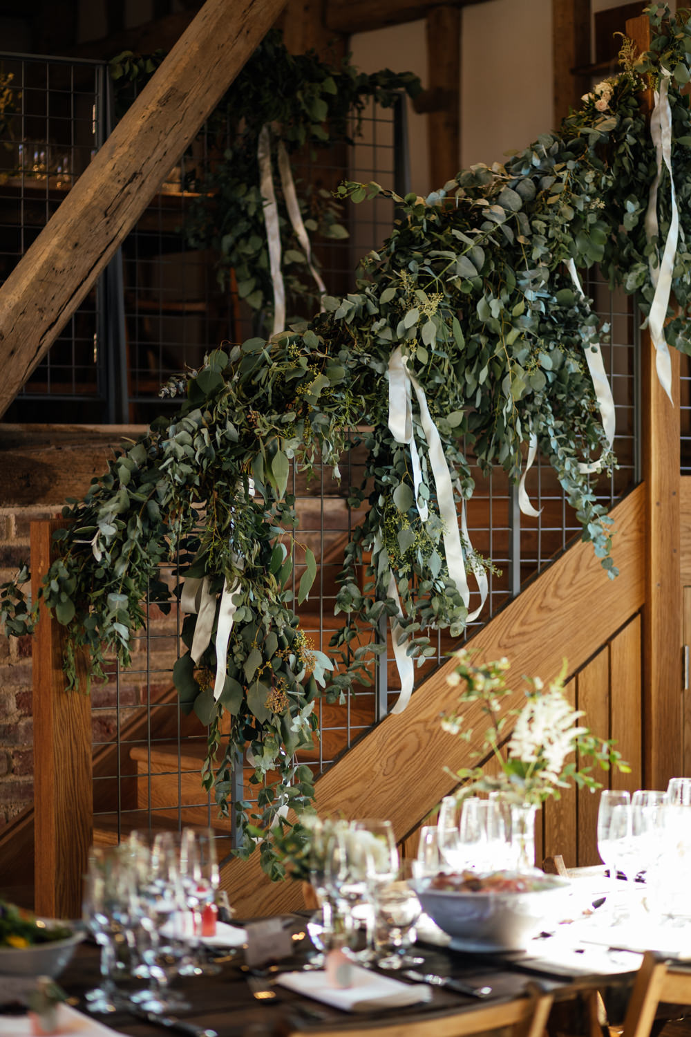 Flowers Rose Eucalyptus Greenery Foliage Stairs Staircase Ribbons Oak Barn Wedding Matilda Delves Photography