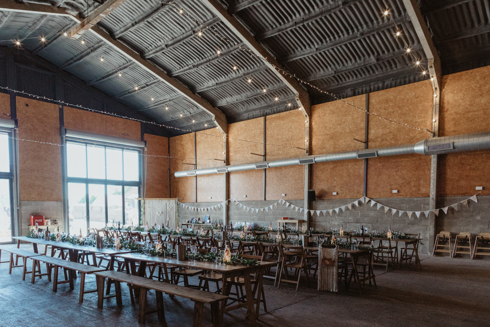 Long Wooden Trestle Tables Chairs Festoon Lights Lighting Barns Lodge Farm Wedding Stevie Jay Photography