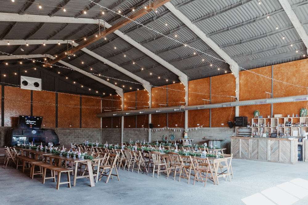 Long Wooden Trestle Tables Chairs Festoon Lights Lighting Barns Lodge Farm Wedding Stevie Jay Photography