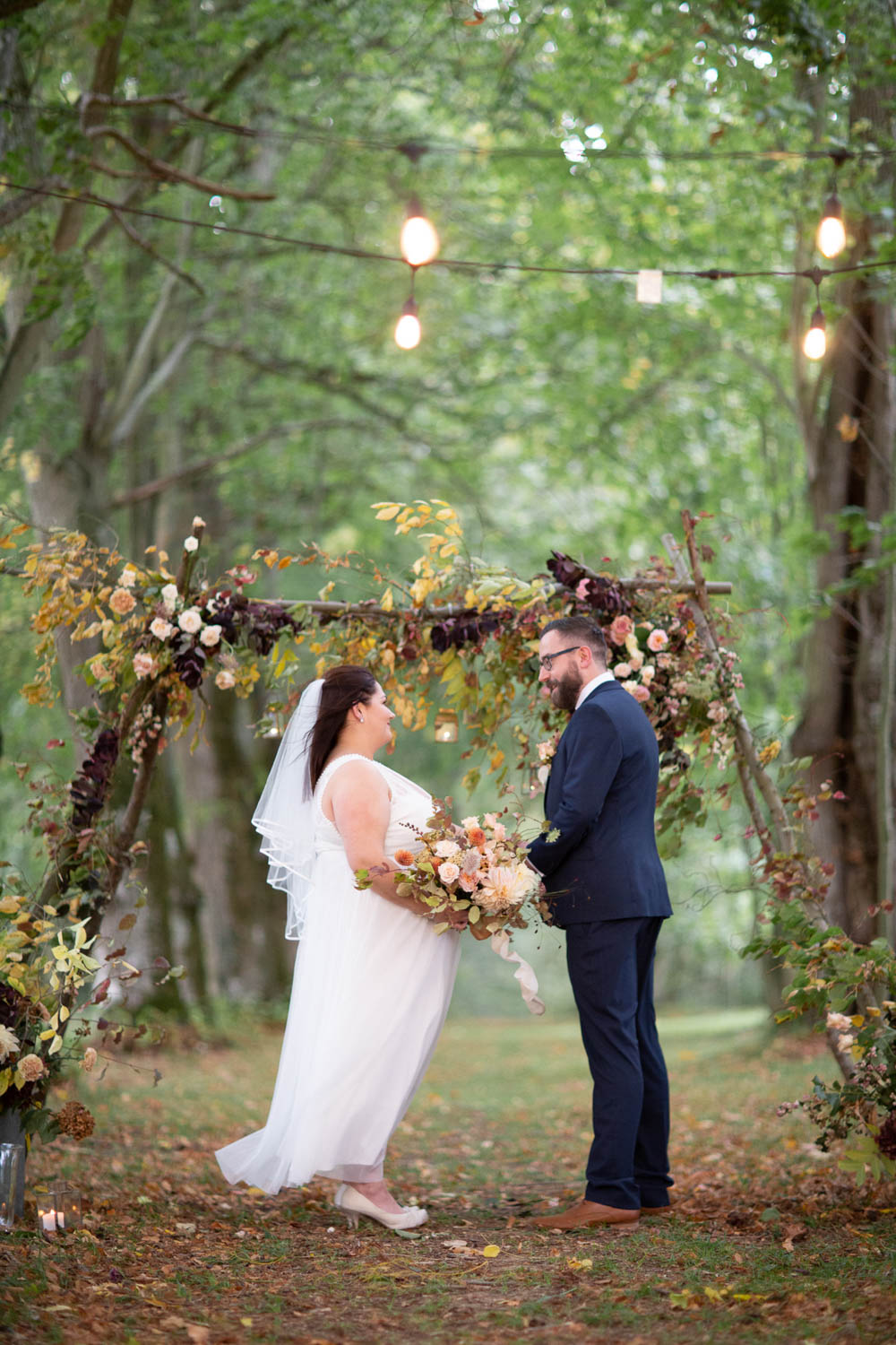 Flower Arch Backdrop Ceremony Woodland Trees Festoon Lights Château Elopement France Maru Photography