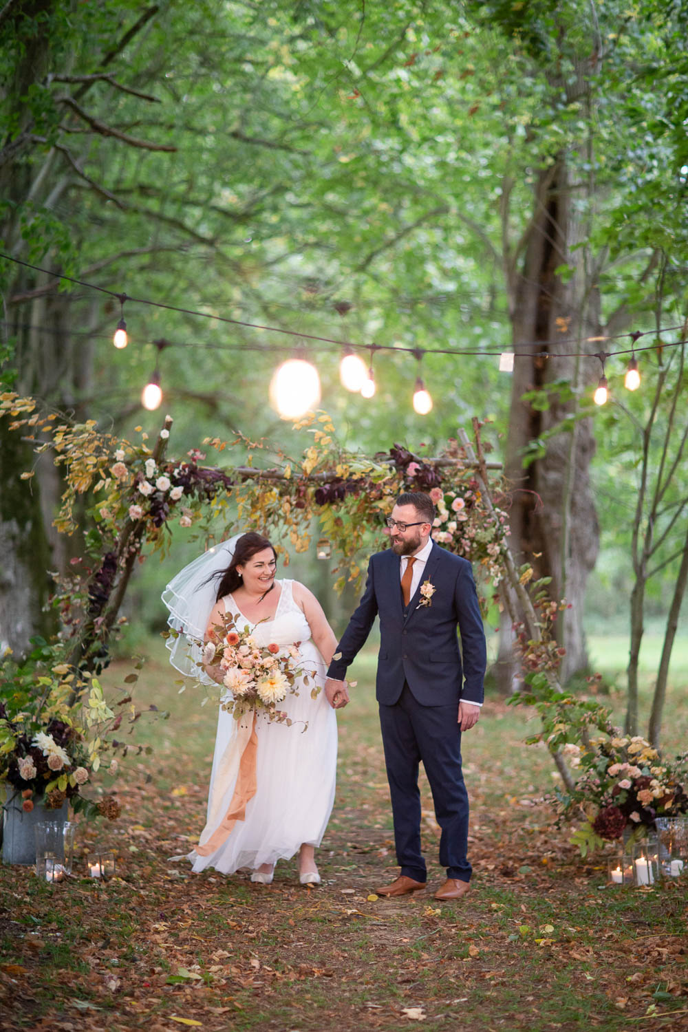 Flower Arch Backdrop Ceremony Woodland Trees Festoon Lights Château Elopement France Maru Photography