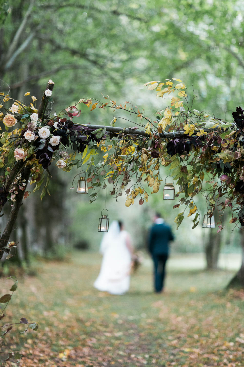 Flower Arch Backdrop Ceremony Woodland Trees Festoon Lights Château Elopement France Maru Photography