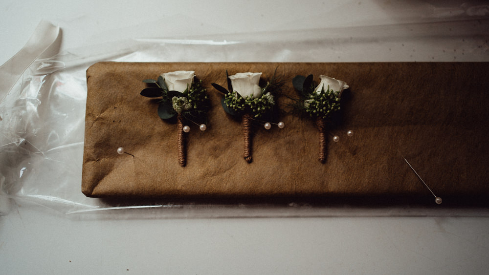 Buttonholes White Rose Countryside Barn Wedding Emily & Steve Photography