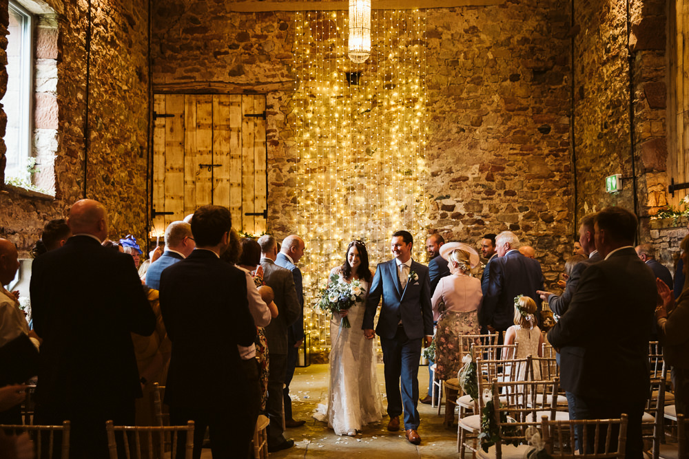 Aisle Ceremony Chairs Lanterns Pew End Flowers Fairy Light Backdrop Eden Barn Wedding Margarita Hope Photography