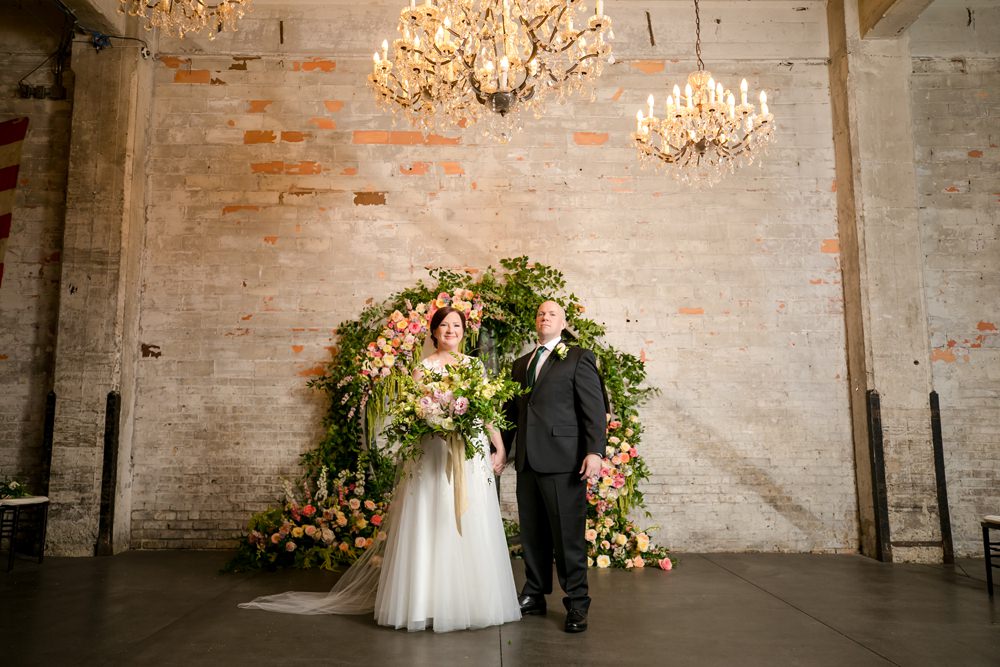 Wooden Wheel Flowers Backdrop Greenery Foliage Peony Rose Floral Minneapolis Wedding Jeannine Marie Photography