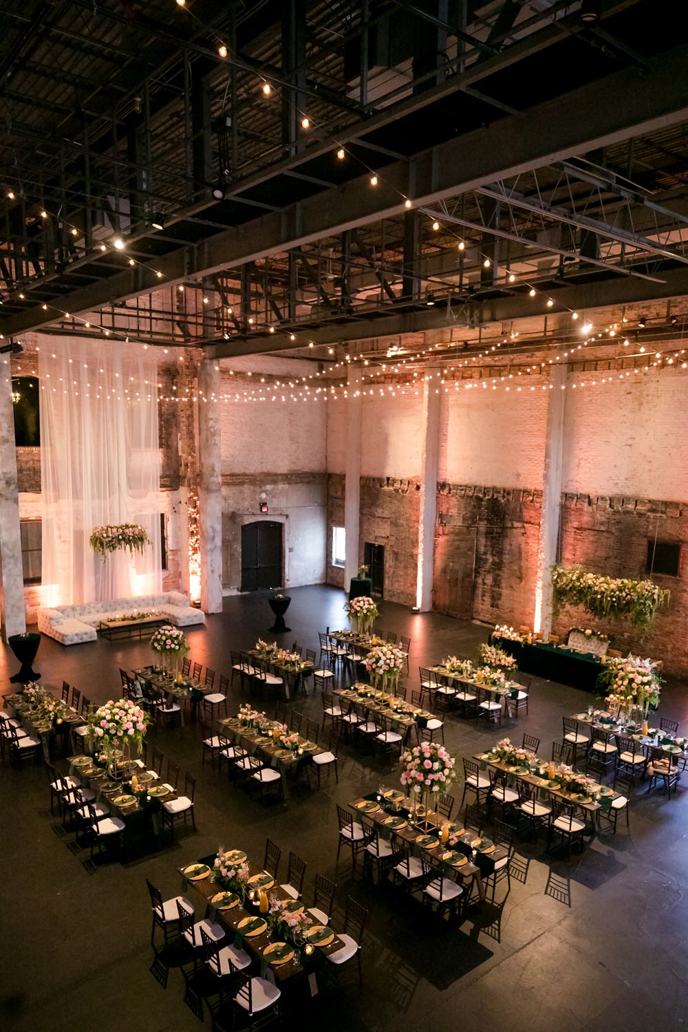 Warehouse Fairy Lights Long Tables Decor Floral Minneapolis Wedding Jeannine Marie Photography