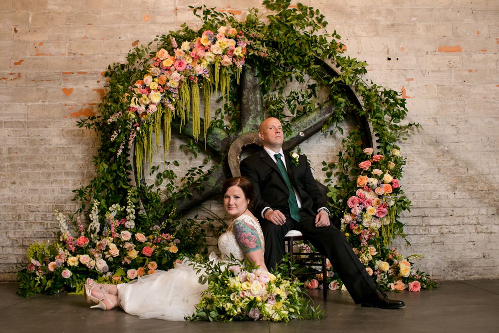 Wooden Wheel Flowers Backdrop Greenery Foliage Peony Rose Floral Minneapolis Wedding Jeannine Marie Photography