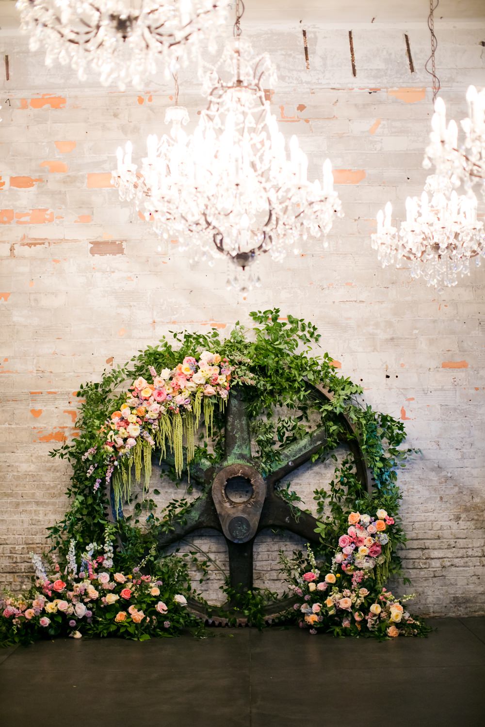 Wooden Wheel Flowers Backdrop Greenery Foliage Peony Rose Floral Minneapolis Wedding Jeannine Marie Photography