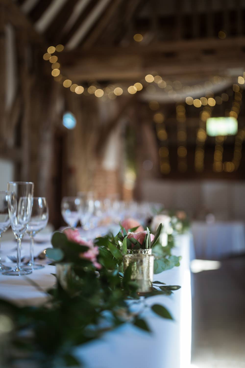 Haughley Park Barn WeddingTop Table Foliage Greenery Flowers Runner Him and Her Wedding Photography