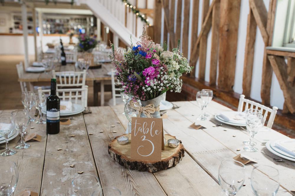Table Centrepiece Flowers Log Slice Table Number Milling Barn Wedding Hertfordshire Emily Tyler Photography