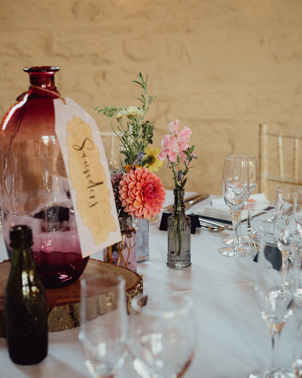 Centrepiece Table Flowers Bottle Table Name Log Slice Priors Court Barn Wedding Emily & Steve Photography