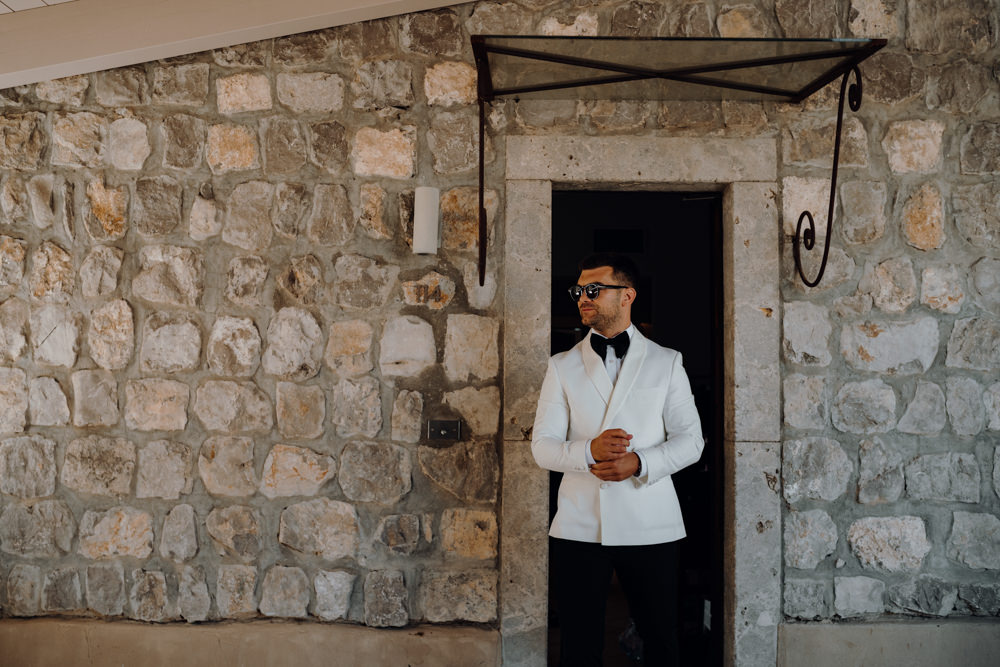 Groom Suit Bow Tie White Jacket Aquapetra Resort Spa Wedding Peter Hughes Photography