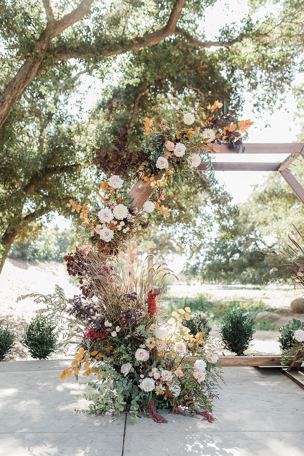 Flower Arch Backdrop Hexagon Flowers Ceremony Aisle California Ranch Wedding WildflowerPhotoCo