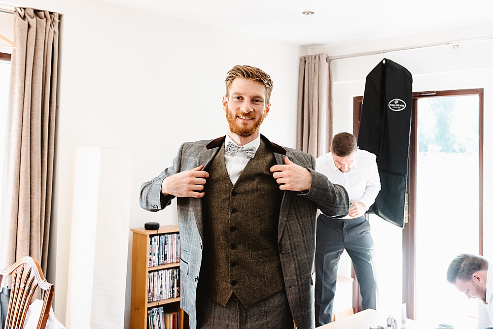 Groom Suit Grey Tweed Bow Tie DIY Tipi Wedding Fiona Kelly Photography