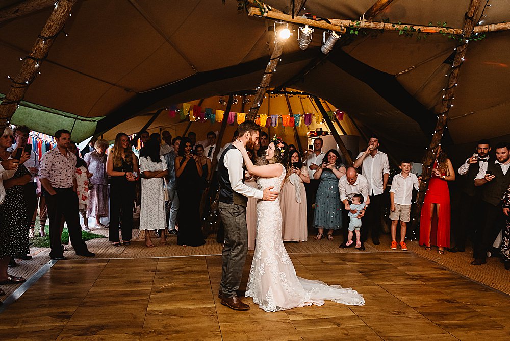 Arch Colourful Rainbow Multicolour Entrance Pom Poms Ribbons Pinwheels DIY Tipi Wedding Fiona Kelly Photography