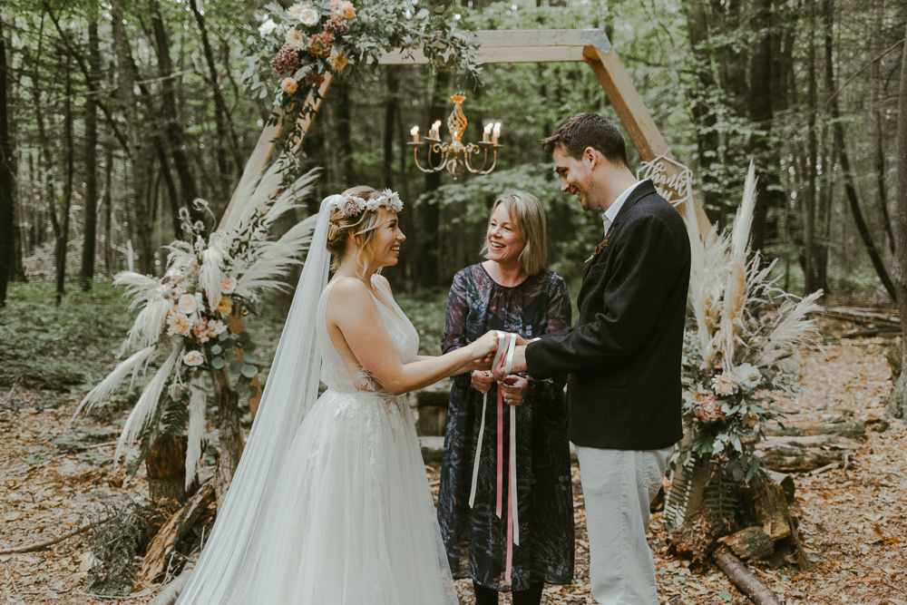 Dreamy Woodland Wedding Ideas Jasmine Andrews Photography Outdoor Ceremony Aisle Hexagon Backdrop Pampas Grass Greenery Foliage