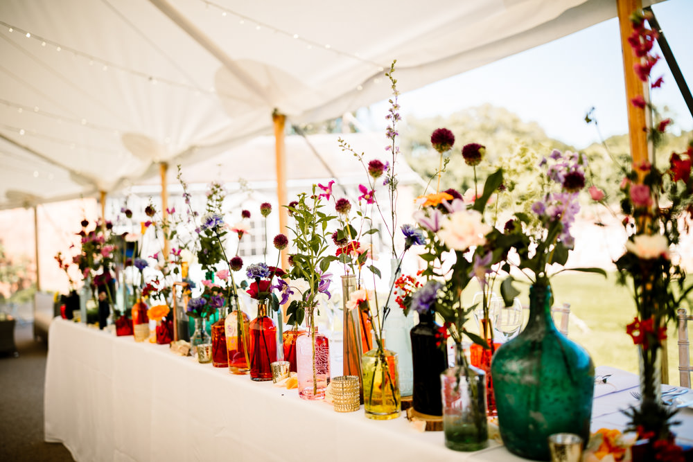 Centepiece Flowers Wild Flowers Decor Table Bottles Top Table Sperry Tent Wedding Hayley Baxter Photography