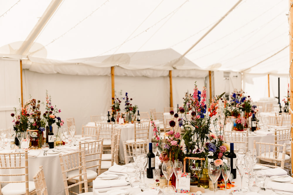 Centepiece Flowers Wild Flowers Decor Table Bottles Top Table Sperry Tent Wedding Hayley Baxter Photography