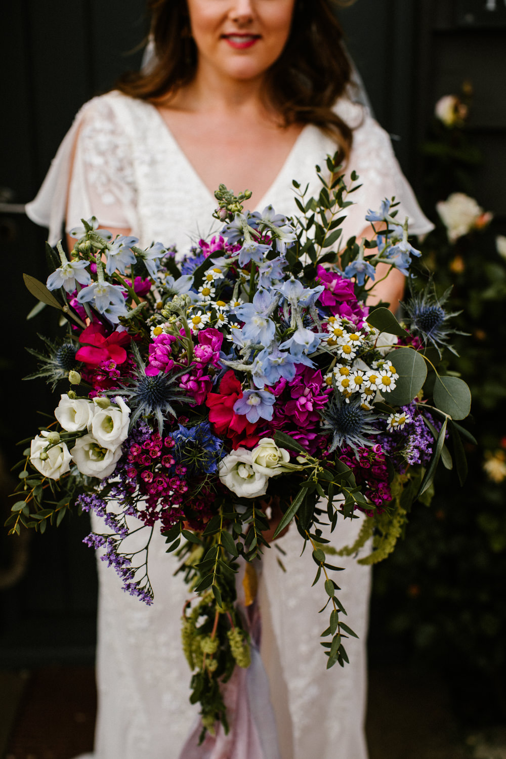 Bouquet Flowers Bride Bridal Lithianthus Daisy Thistle Wax Flower Pink Blue Titchwell Manor Wedding Honey and The Moon Photography