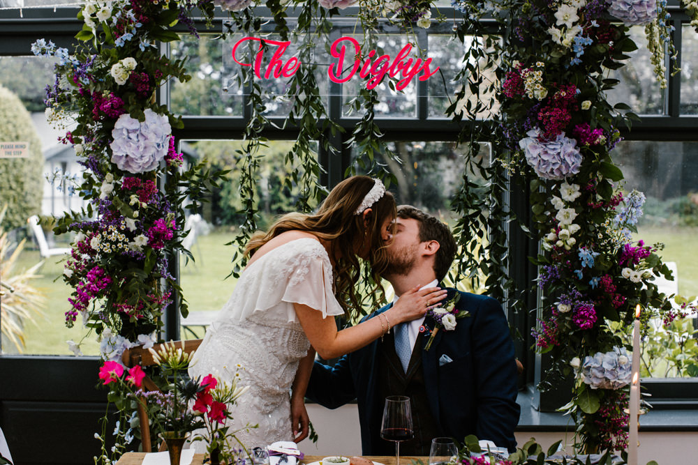 Flower Arch Backdrop Top Table Sign Hydrangea Wisteria Titchwell Manor Wedding Honey and The Moon Photography