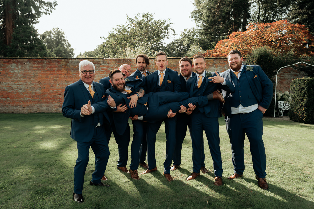 Groom Suit Navy Mustard Yellow Tie Pocket Square Groomsmen Combermere Abbey Wedding Damian Brandon Photography