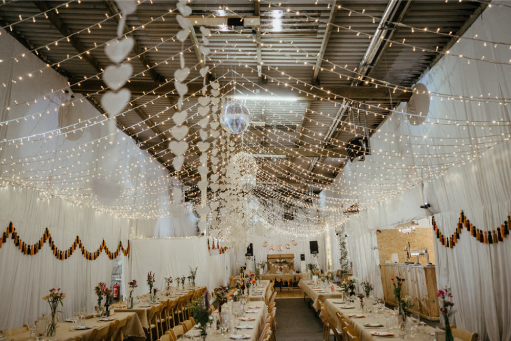 Barn Fairy Lights Lighting Canopy Long Tables Bunting Decor Hearts Literary Wedding Naomi Jane Photography