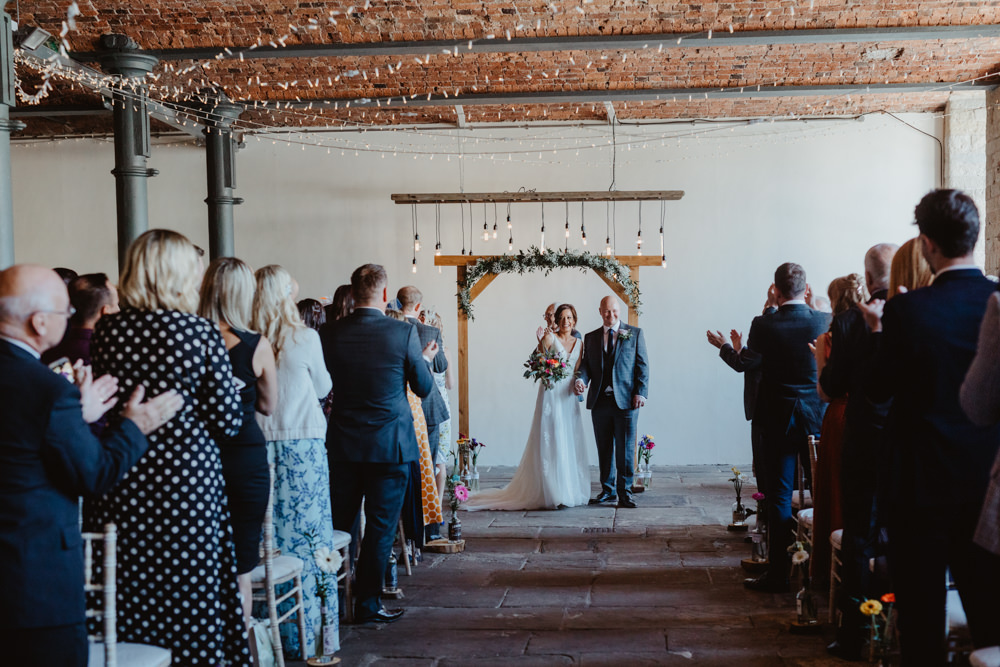 Wooden Frame Backdrop Arch Greenery Foliage Festoon Lights Edison Lighting Arches Dean Clough Wedding Stevie Jay Photography