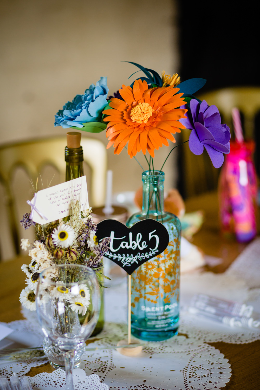 Centrepiece Decor Colorful Paper Flowers Bottles Table Number Cowshed Woodhall Farm Wedding Emma and Rich