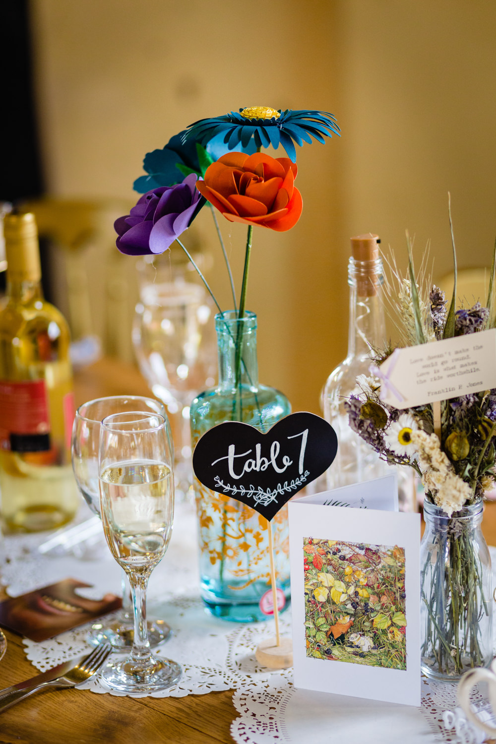 Centrepiece Decor Colorful Paper Flowers Bottles Table Number Cowshed Woodhall Farm Wedding Emma and Rich