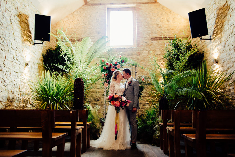 Ceremony Backdrop Plants Greenery Foliage Neon Sign Tropical Wedding Inspiration Emily Little Photography