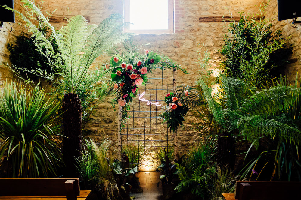 Ceremony Backdrop Plants Greenery Foliage Neon Sign Tropical Wedding Inspiration Emily Little Photography