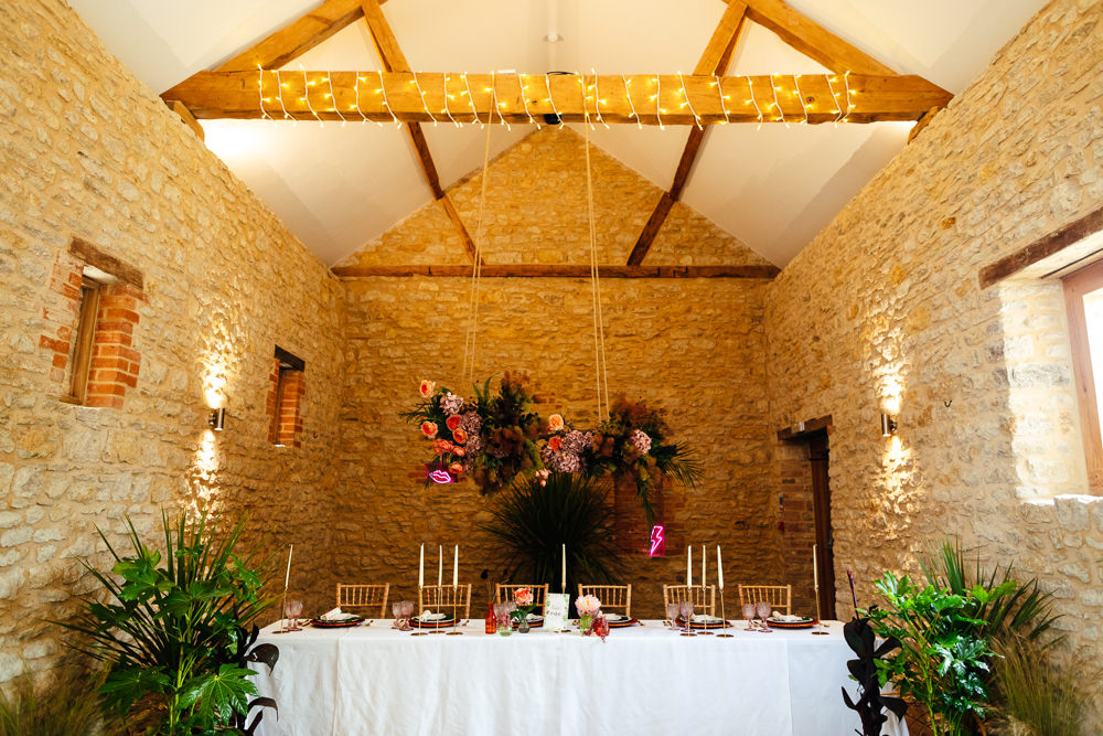 Barn Plants Hanging Suspended Table Tablescape Flowers Candles Tropical Wedding Inspiration Emily Little Photography