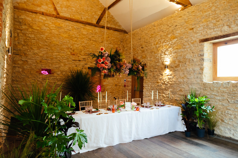 Barn Plants Hanging Suspended Table Tablescape Flowers Candles Tropical Wedding Inspiration Emily Little Photography