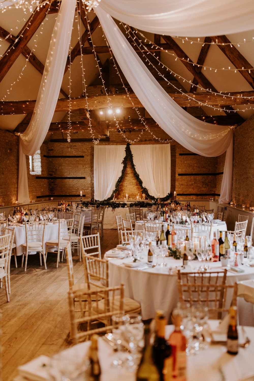 Barn Reception Venu Backdrop Drapes Fabric Greenery Fairy Lighs Lighting Canopy Wick Farm Bath Wedding Siobhan Beales Photography