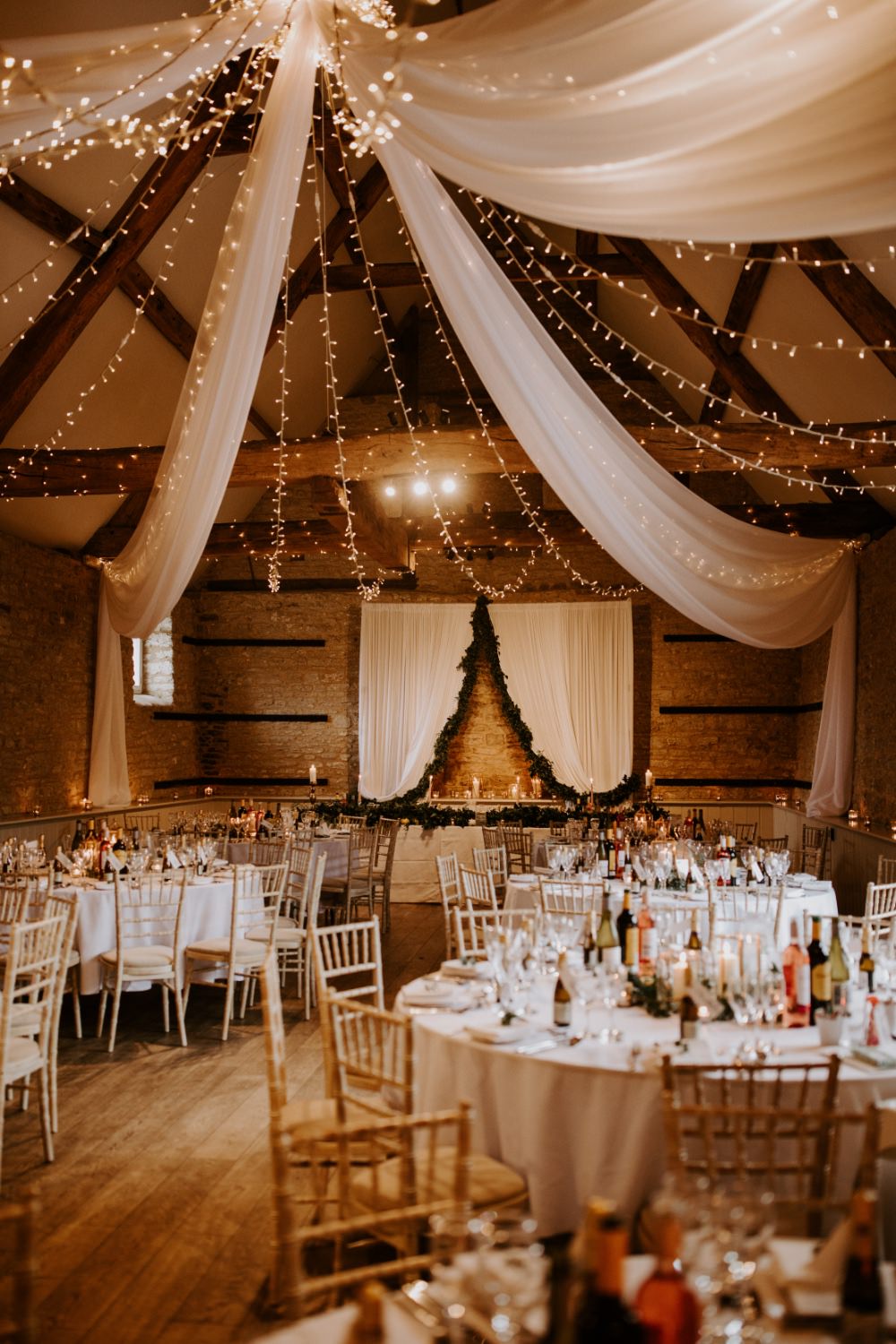Barn Reception Venu Backdrop Drapes Fabric Greenery Fairy Lighs Lighting Canopy Wick Farm Bath Wedding Siobhan Beales Photography
