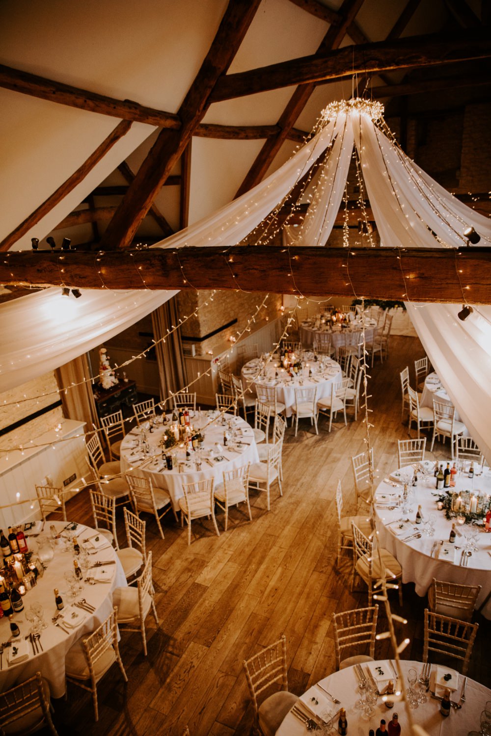 Barn Reception Venu Backdrop Drapes Fabric Greenery Fairy Lighs Lighting Canopy Wick Farm Bath Wedding Siobhan Beales Photography