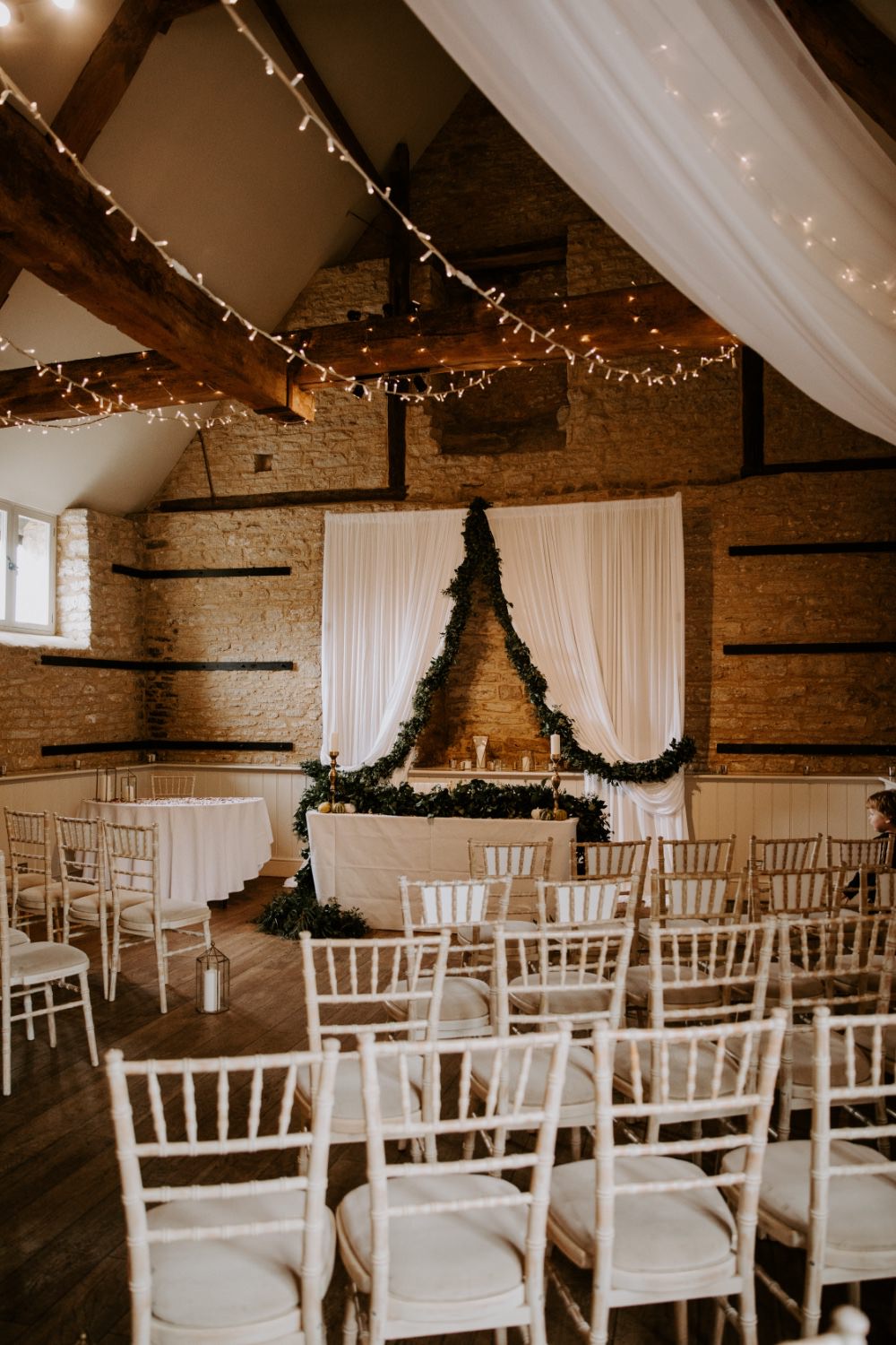 Barn Ceremony Backdrop Drapes Fabric Greenery Fairy Lighs Lighting Canopy Wick Farm Bath Wedding Siobhan Beales Photography