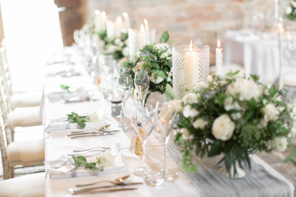 Table Centrepiece Decor Flowers Candlesticks Silk Runner Almonry Barn Wedding Kerry Bartlett Photography