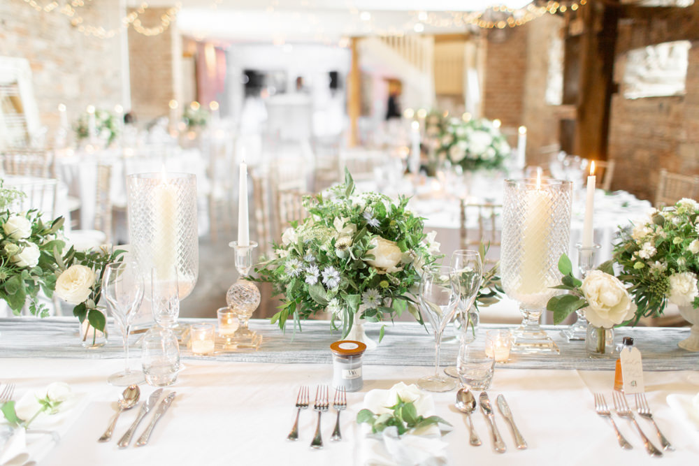 Table Centrepiece Decor Flowers Candlesticks Silk Runner Almonry Barn Wedding Kerry Bartlett Photography