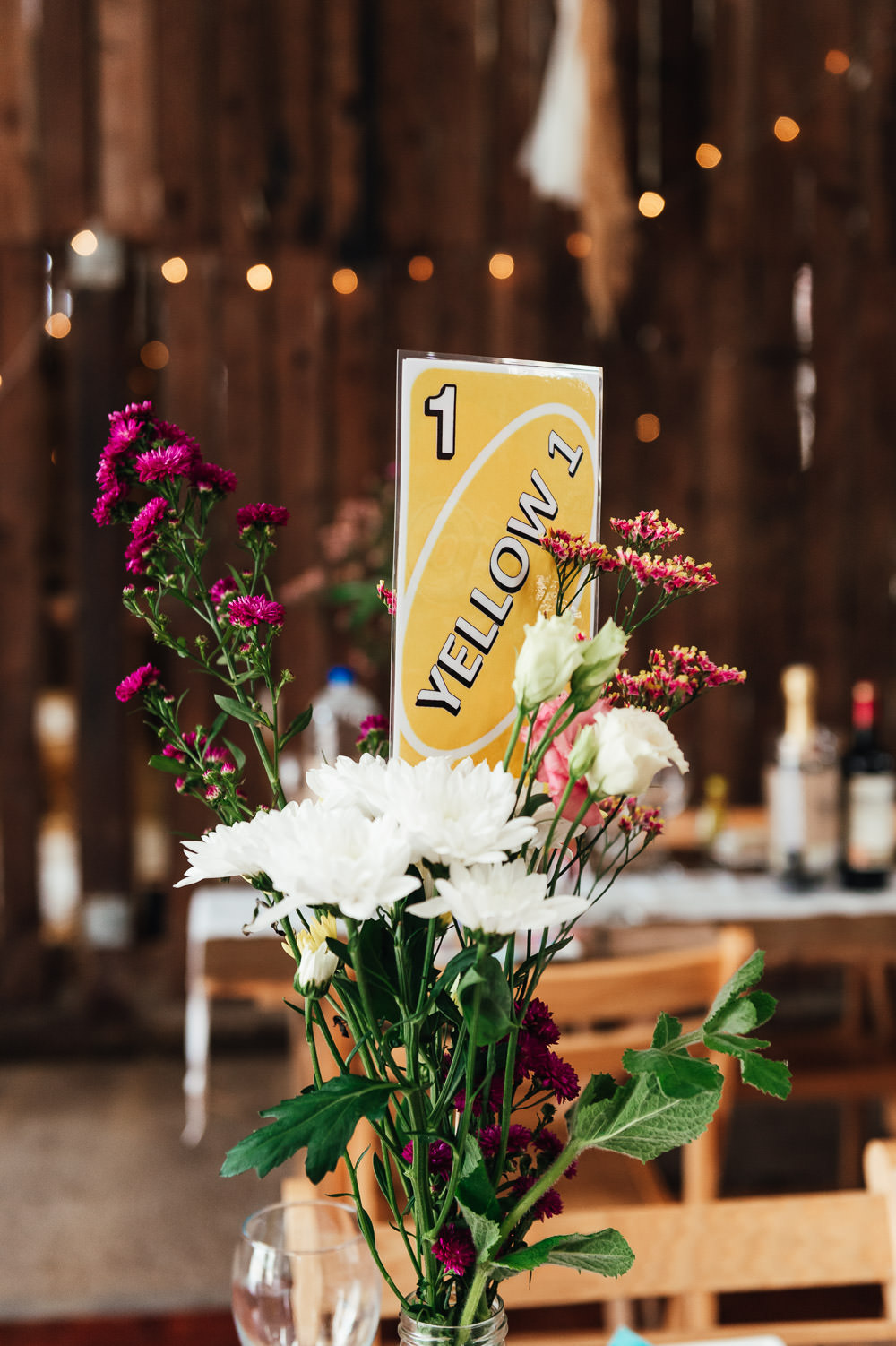 Table Flowers Decor Centrepiece Table Name Number Uno DIY Barn Wedding Jessica Grace Photography