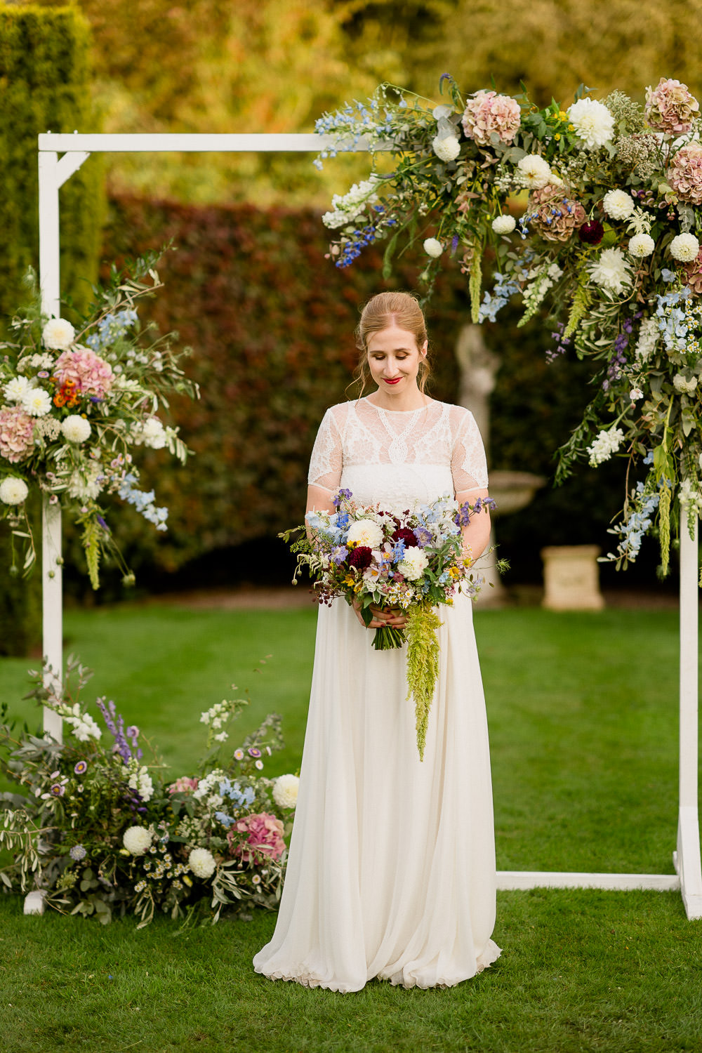 Flower Arch Floral Backrop Dress Gown Bride Bridal Sleeves Valentina Grace Loves Lace Holford Estate Wedding Voyteck Photography