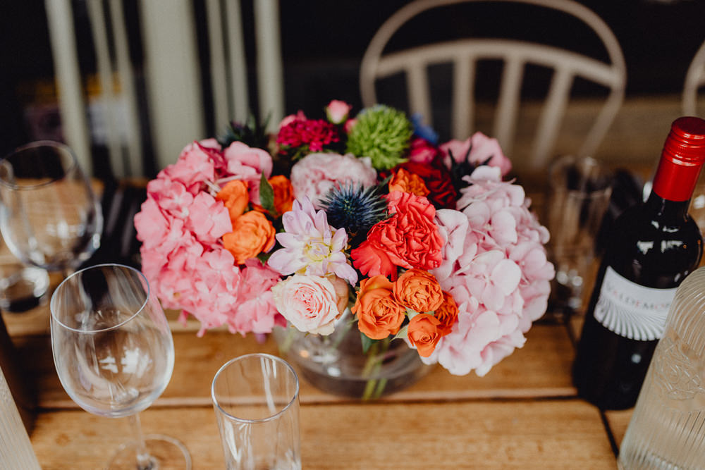 Table Centrepiece Flowers Arrangement Display Colourful Hydrangeas Ranunculi Peonies Intimate Pub Wedding Heather Sham Photography