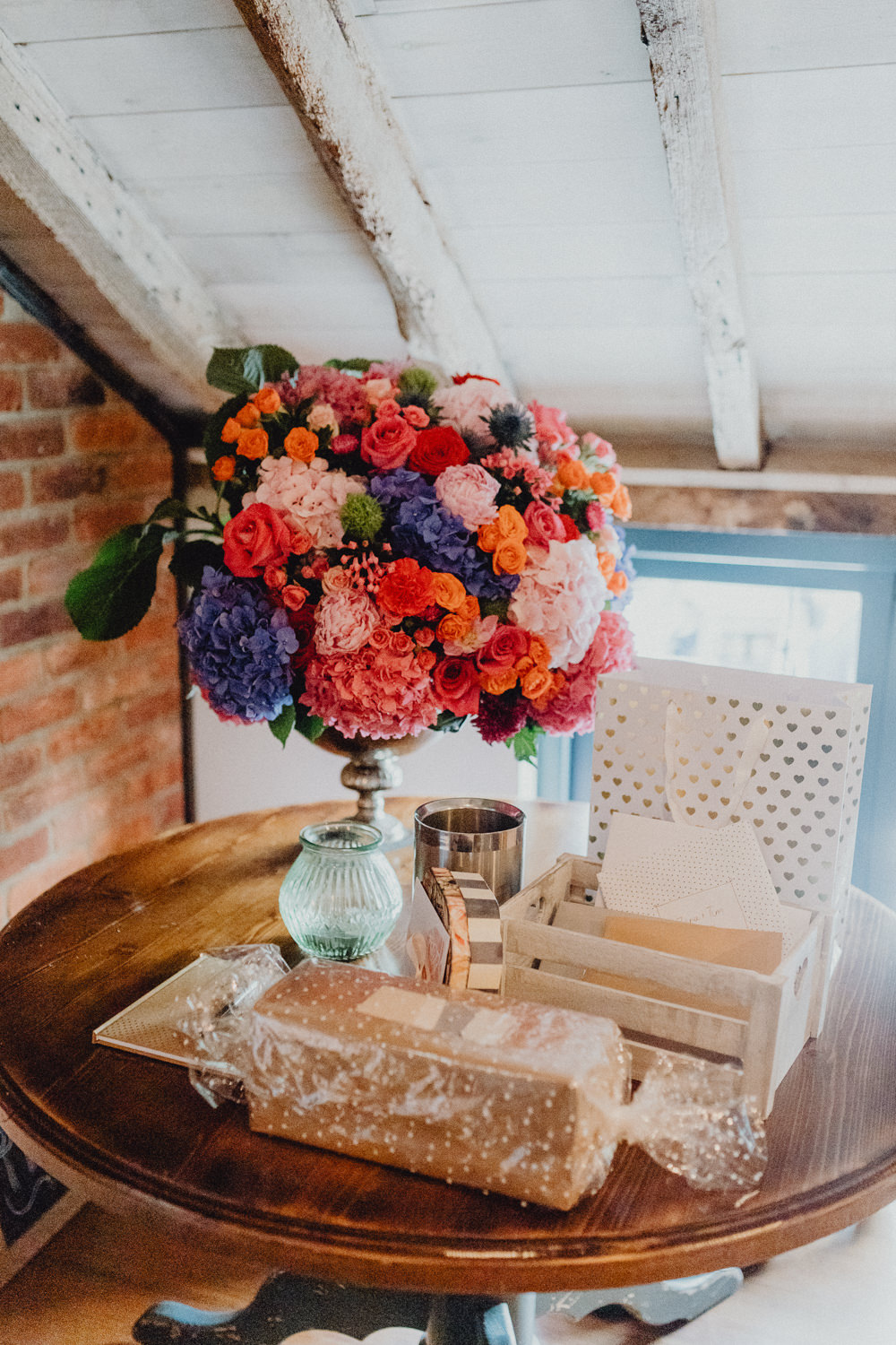 Table Centrepiece Flowers Arrangement Display Colourful Hydrangeas Ranunculi Peonies Intimate Pub Wedding Heather Sham Photography