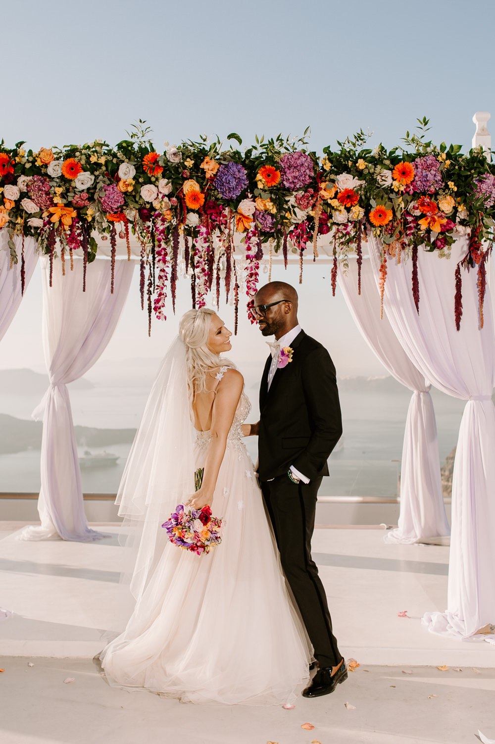 Santorini Wedding Phosart Photography Ceremony Backdrop Aisle Flower Arch Pampas Grass Rose Colourful