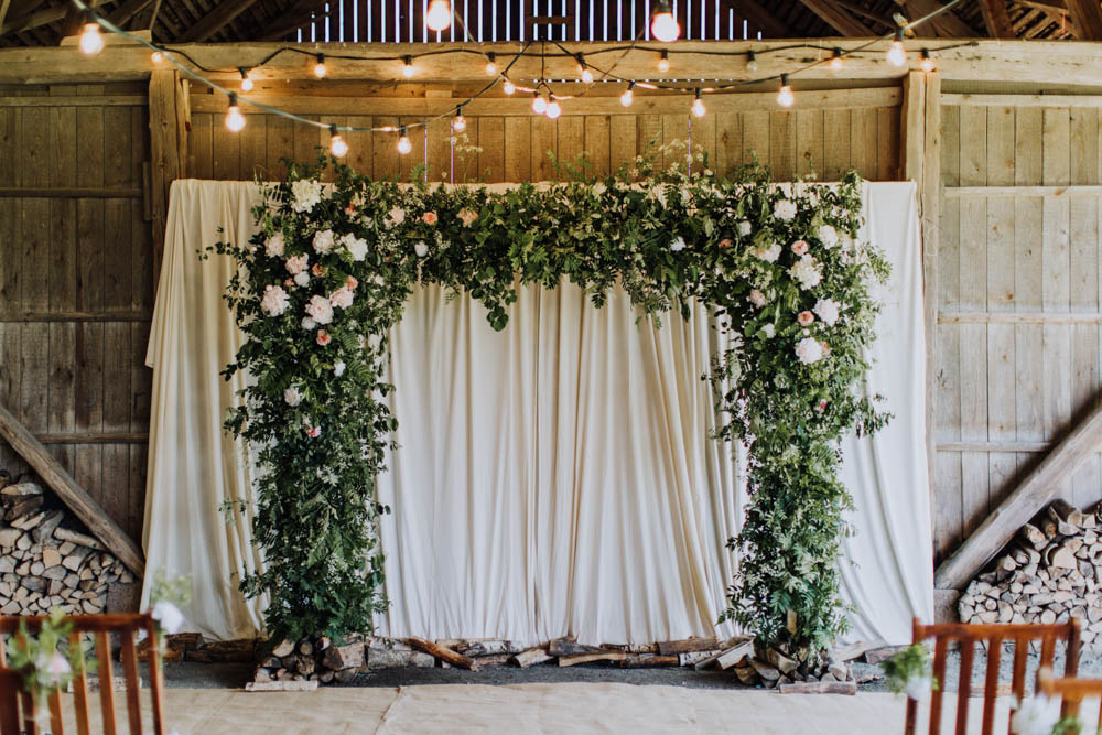 Flower Arch Backdrop Ceremony Aisle Greenery Foliage Sweden Destination Wedding Clara Cooper Photography