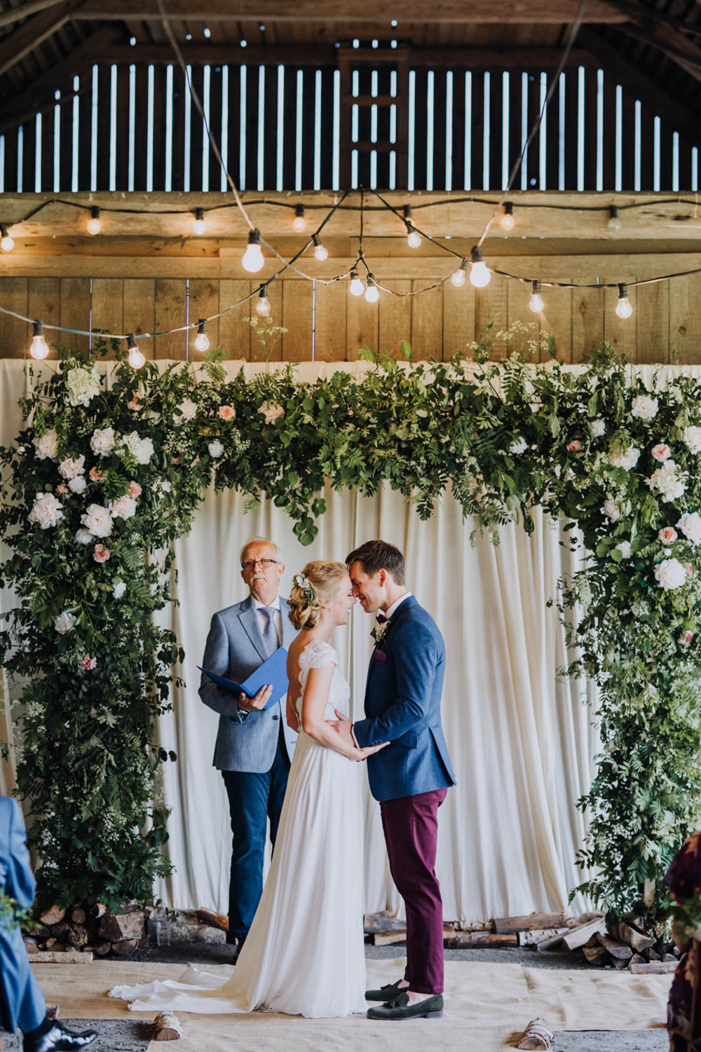Flower Arch Backdrop Ceremony Aisle Greenery Foliage Sweden Destination Wedding Clara Cooper Photography