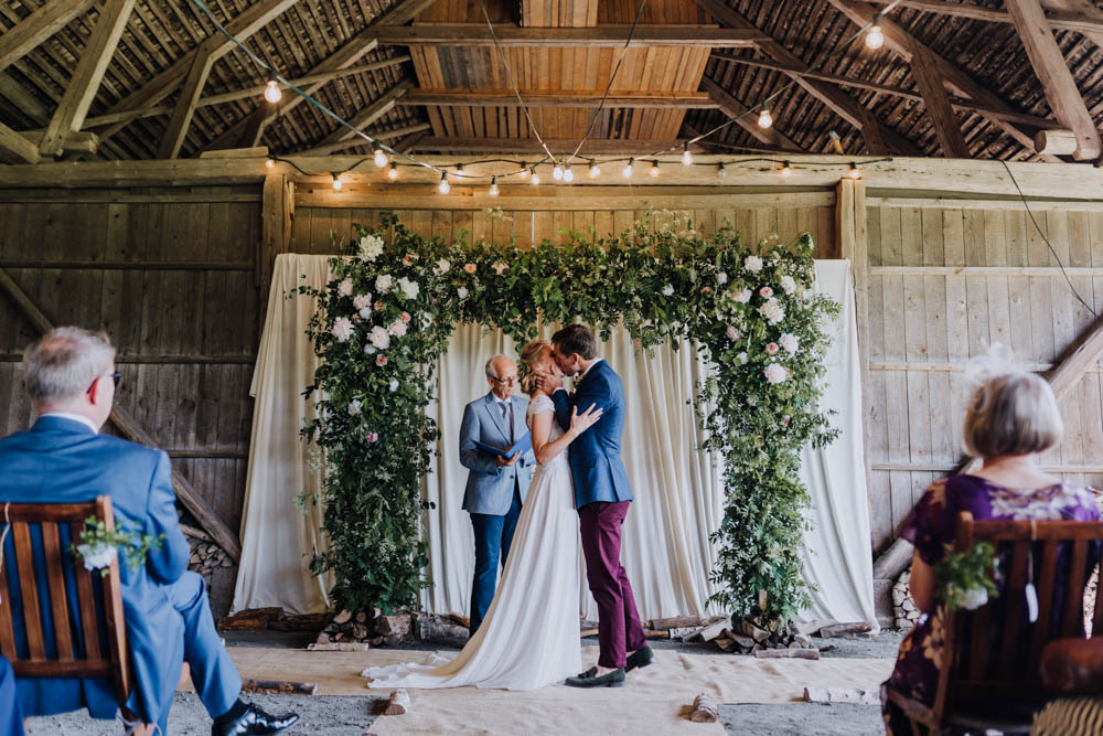 Flower Arch Backdrop Ceremony Aisle Greenery Foliage Sweden Destination Wedding Clara Cooper Photography