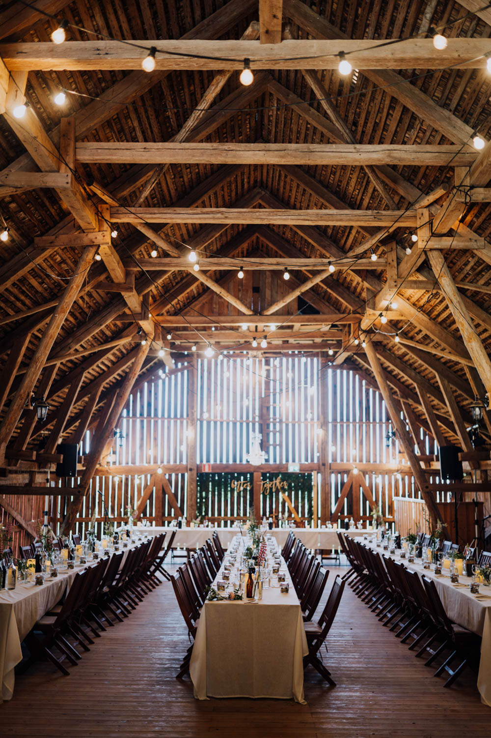 Barn Festoon Lights Long Tables Decor Reception Sweden Destination Wedding Clara Cooper Photography