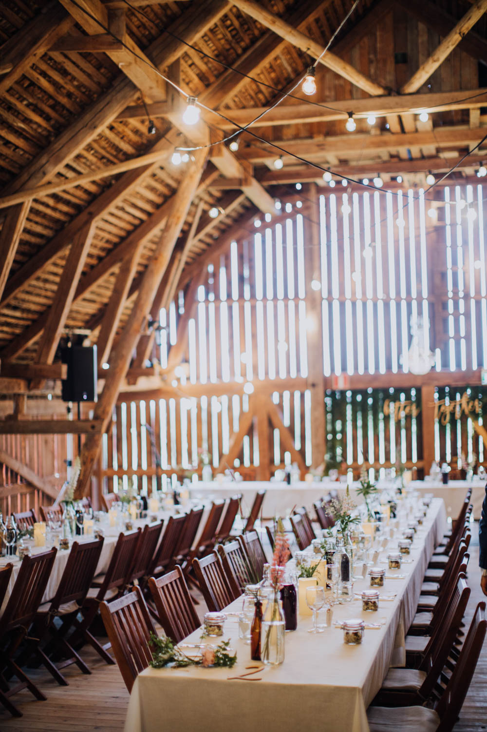 Barn Festoon Lights Long Tables Decor Reception Sweden Destination Wedding Clara Cooper Photography