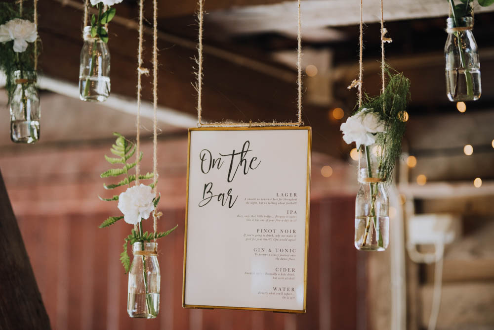 Flowers Bottles Hanging Suspended Sweden Destination Wedding Clara Cooper Photography